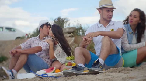 Group of Four Friends Having Fun on the Beach.  Picnic on the Nature Stock Footage 60843815