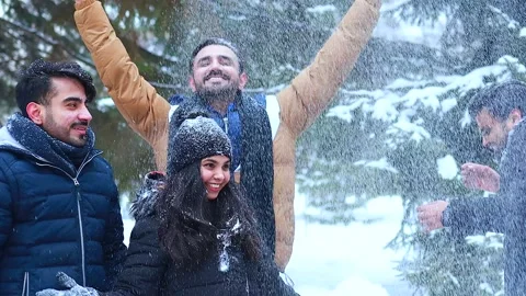 Group of four indian having fun playing in snow outdoors spending Chrisymas Stock Footage 146327646