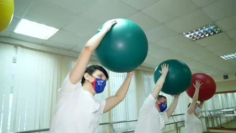 Group of four people do exercises of medical physical culture Stock Footage 185434343