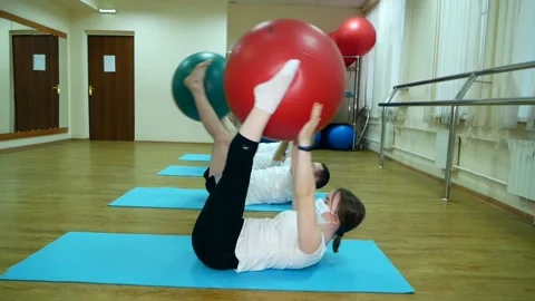 Group of four people do exercises of medical physical culture Stock Footage 185434365