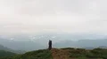 The group of four people standing on a mountain top 4k or 4k+ Resolution
