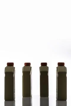 Group of four plastic engine oil. Stock Photos