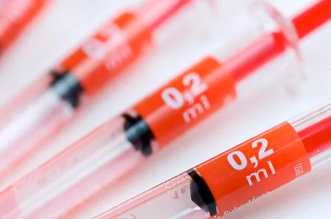 Group of four red needles Stock Photos