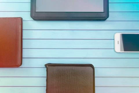 A Group of Four Studing the Bible Using Tablets Phone and Paper Bibles Stock Photos