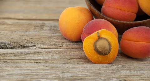Group of fresh apricots isolated on rustic wooden table Collection of ripe... 스톡 사진