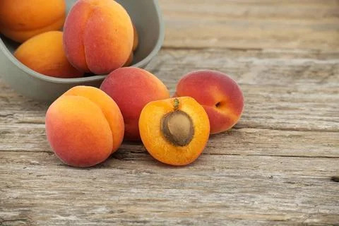 Group of fresh apricots isolated on rustic wooden table Collection of ripe... 스톡 사진