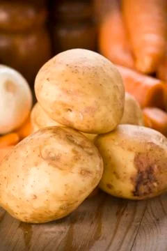 Group of fresh potatoes on the  table Фото