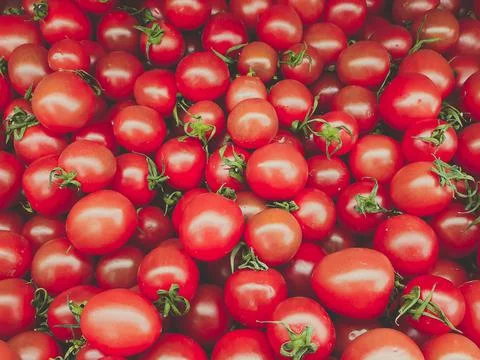 Group of fresh red cherry tomatoes at market Stock Photos
