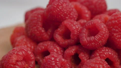 Group of fresh red raspberry  on wood Stock Footage 143712735