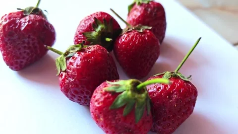 Group of fresh ripe strawberries on white background. Stock Footage 340335053