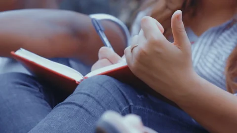Group of freshmen students after first day at school sitting outdoors and Video stock 134332430