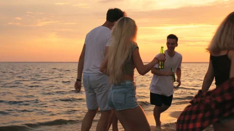 Group of friends dancing on the beach.  Stock Footage 93539352