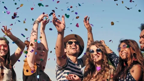 Group of friends dancing in confetti Stock Footage 109332476
