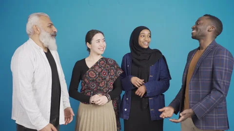 Group of friends from different races chatting and having fun.  Stock Footage 228845791
