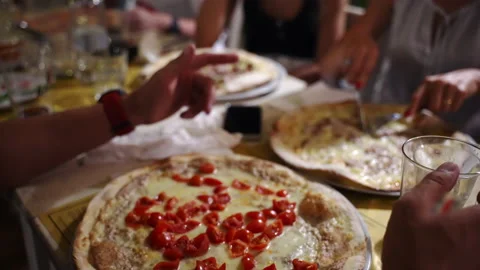Group of friends dining in local restaurant, tasting delicious traditional Stock-Footage 158761858