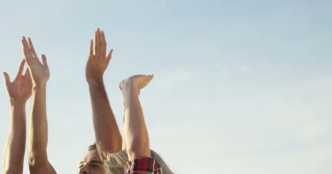 Group of friends doing high five Stock Footage 60409284