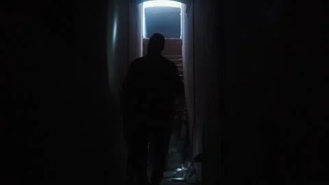 Group of friends with flashlights walking through dark tunnels Stock Footage 195764723