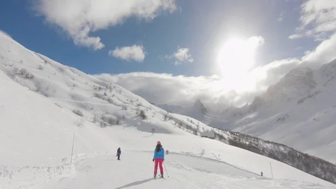 Group of friends gathering at a ski slope with an amazing view of mountains Stock Footage 129310228
