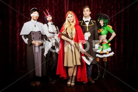 Group of friends in halloween costumes Stock Photos