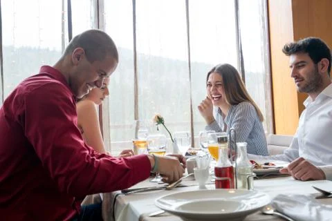 Group of friends having dinner Stock Photos