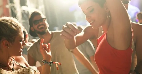 Group of friends having fun and dancing at concert Stock Footage 78783477