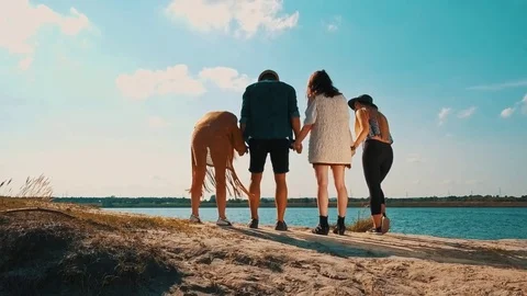 Group of friends having fun at the beach Stock Footage