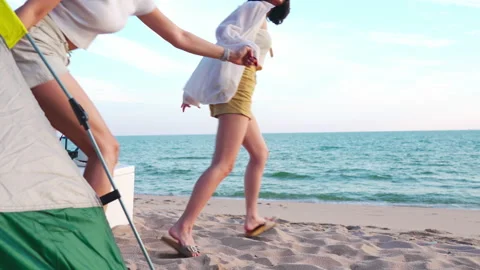 Group of friends having fun on the beach camp Stock Footage 171924737