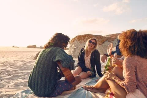 Group of friends having fun at the beach party Stock Photos