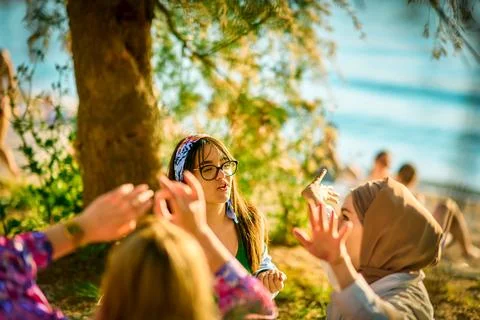 Group of friends having fun on the beach Stock Photos