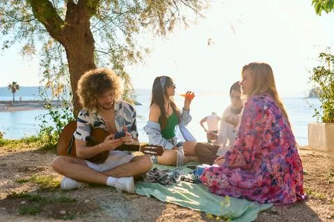 Group of friends having fun on the beach Stock Photos