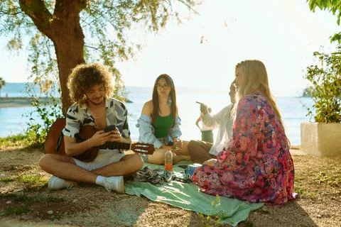 Group of friends having fun on the beach Stock Photos