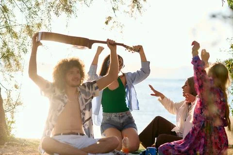 Group of friends having fun on the beach Stock Photos