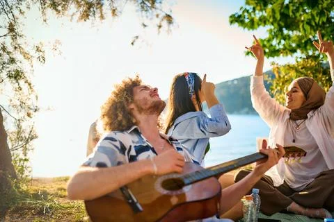 Group of friends having fun on the beach Stock Photos