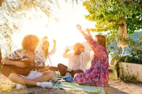 Group of friends having fun on the beach Stock Photos