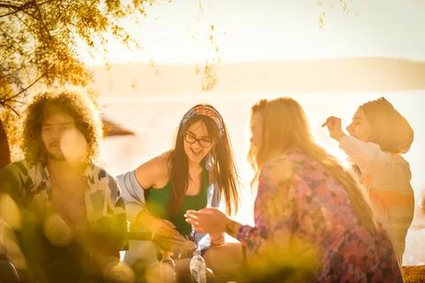 Group of friends having fun on the beach Stock Photos