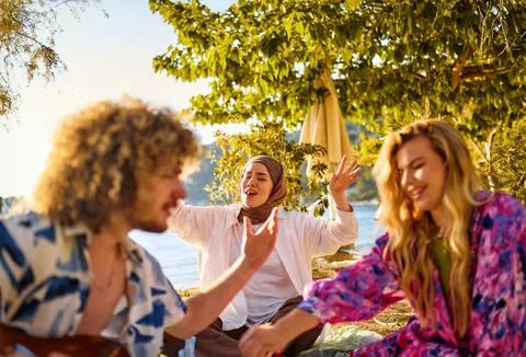 Group of friends having fun on the beach Stock Photos