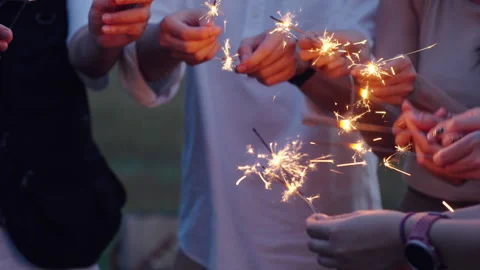 Group of friends having fun camping party outdoor with sparkles light Stock Footage 243974652