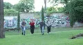 group of friends having fun at the park exulting - jump - hug - run HD Footage