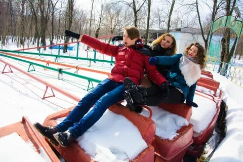 Group of friends having fun in the park in winter Stock Photos