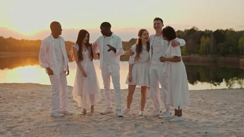 Group of friends having fun at the party on a lake beach Video stock 197166703