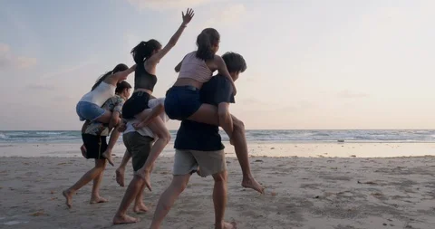 Group of Friends having fun running on the beach with happy emotion. Stock Footage 104072058