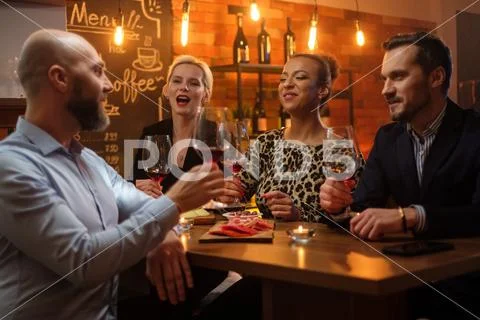 Group Of Friends Having Fun Talk Behind Bar Counter In A Cafe