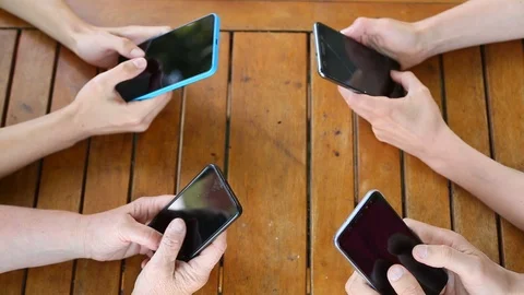 Group of friends having fun together with smartphones. Close-up mobile phone  Stock Footage 112173205