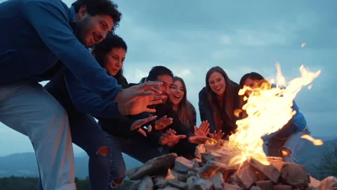 Group of friends having fun together at night party around bonfire - Friendship Stock Footage 224674124