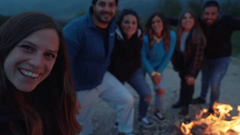 Group of friends having fun together at night party around bonfire - Friendship Stock Footage 224692726