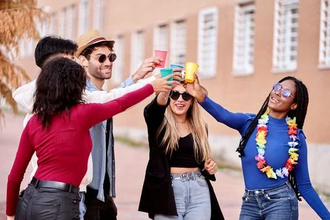 Group of friends having fun while partying together outdoors. Fotos Stock