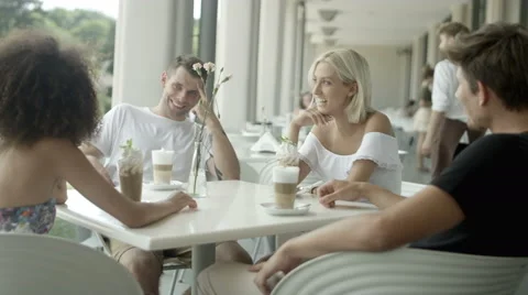 Group of friends having good time at outdoor cafe. 動画素材 66529480