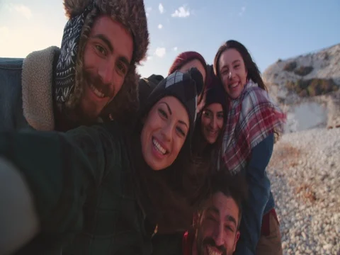 Group of friends looking at camera and taking a selfie Stock Footage