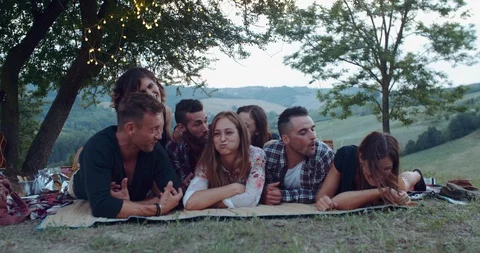 Group of friends making faces during the pic nic. shot in slow motion Stock Footage 93075670