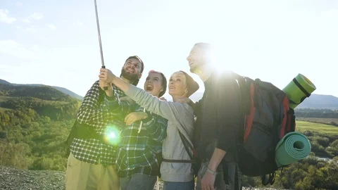 Group of friends making selfie on the mountain background. Stock Footage 103727140